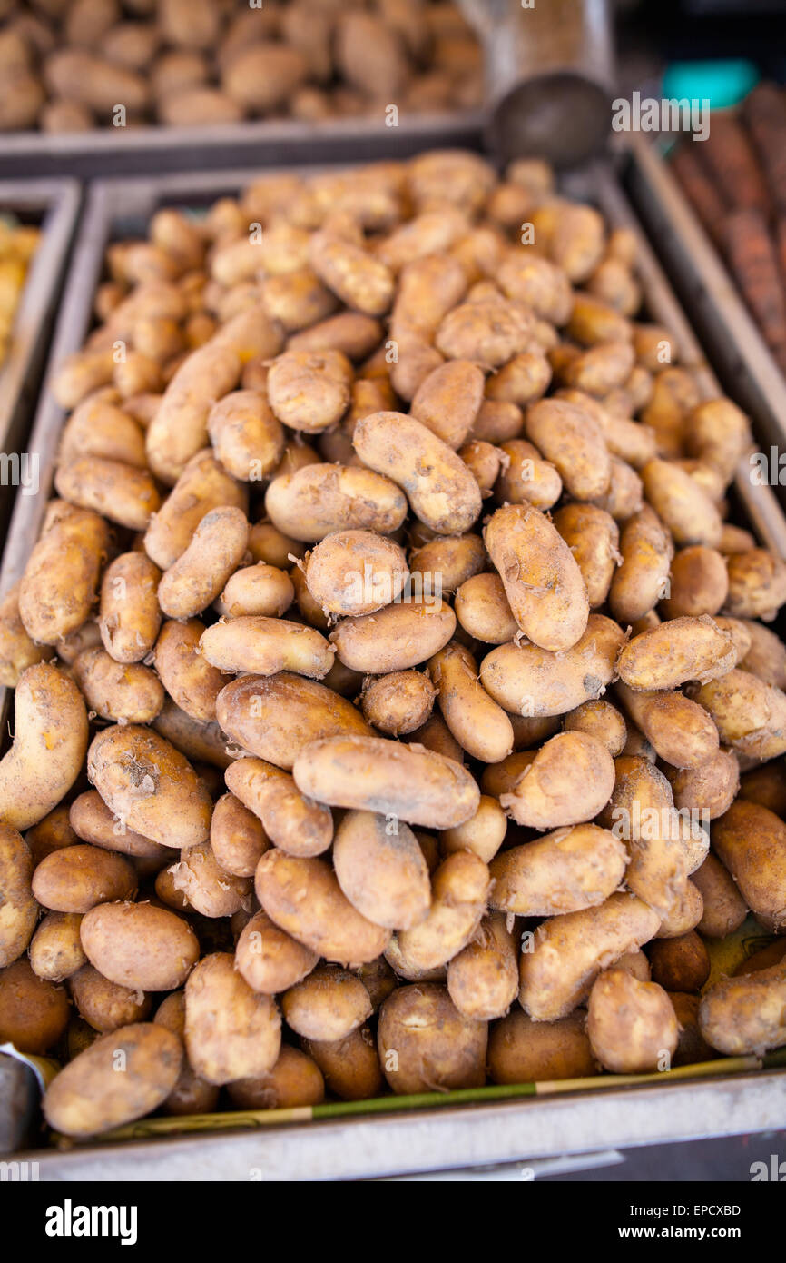 Fresh and ripe potatoes on market stall Stock Photo