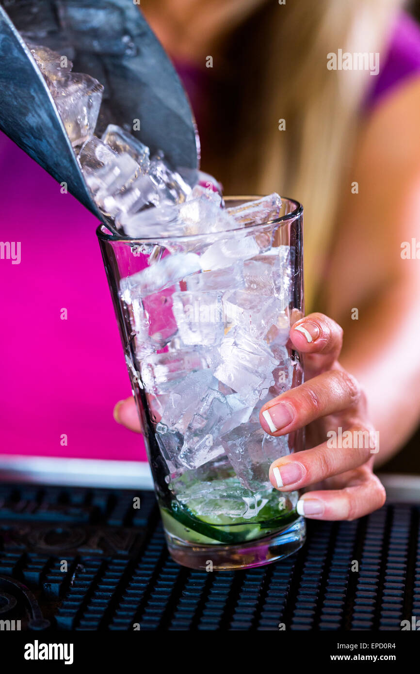 Bartender making Front porch cocktail in Italian restaurant Stock Photo