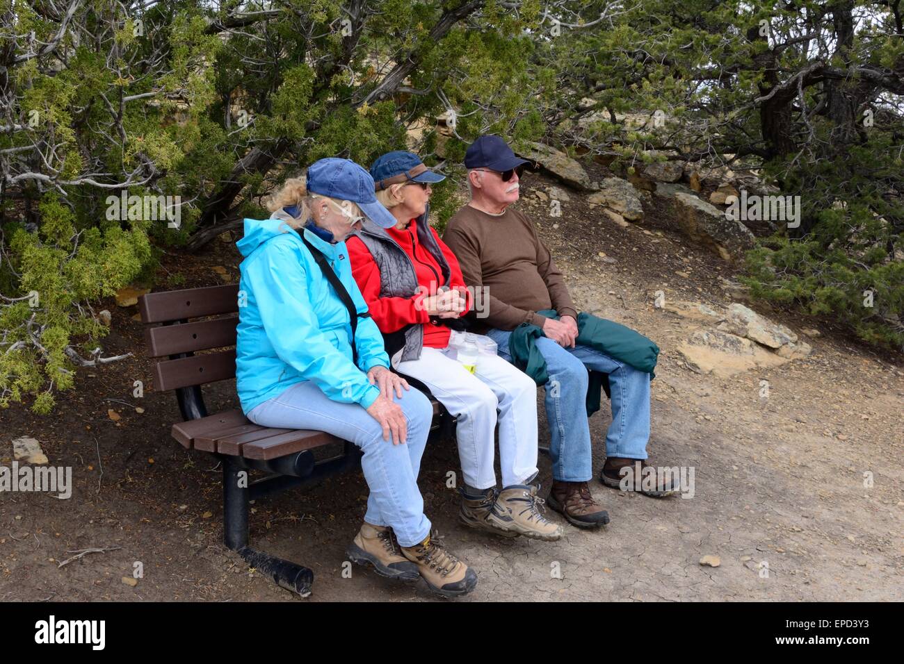 Three Seniors on a bench at El Morro National Monument New Mexico - USA Stock Photo