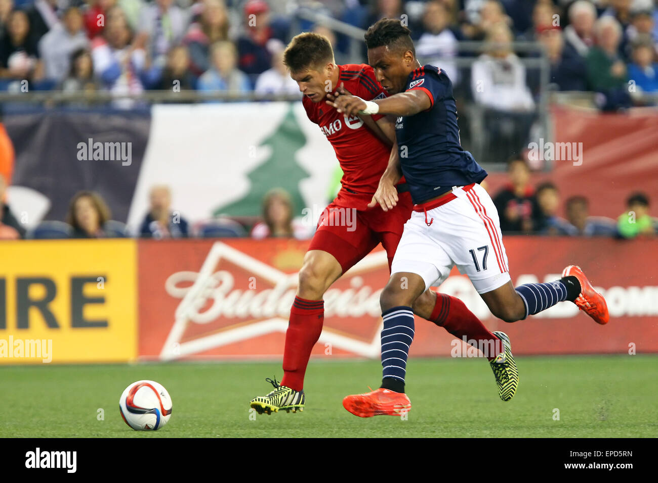 Foxborough, Massachusetts, USA. 16th May, 2015. Toronto FC defender Nick Hagglund (6) and New England Revolution forward Juan Agudelo (17) battle for the ball dyring the first half of an MLS game between the New England Revolution and Toronto FC at Gillette Stadium. New England and Toronto played to a 1-1 tie. Credit:  Cal Sport Media/Alamy Live News Stock Photo