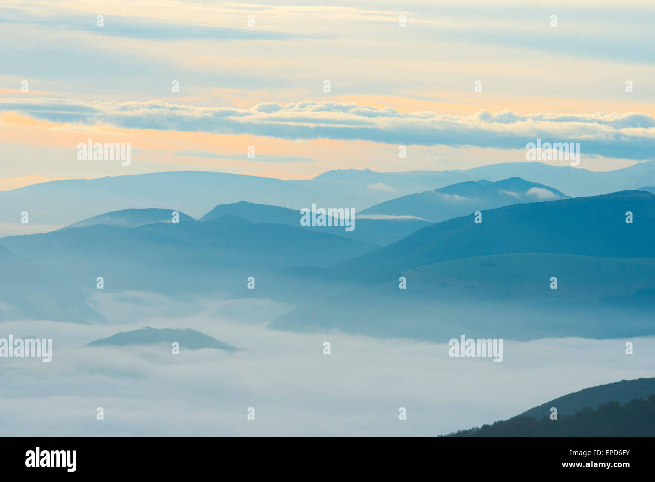 Silhouette of mountains at sunrise, Apennines, Umbria, Italy Stock Photo