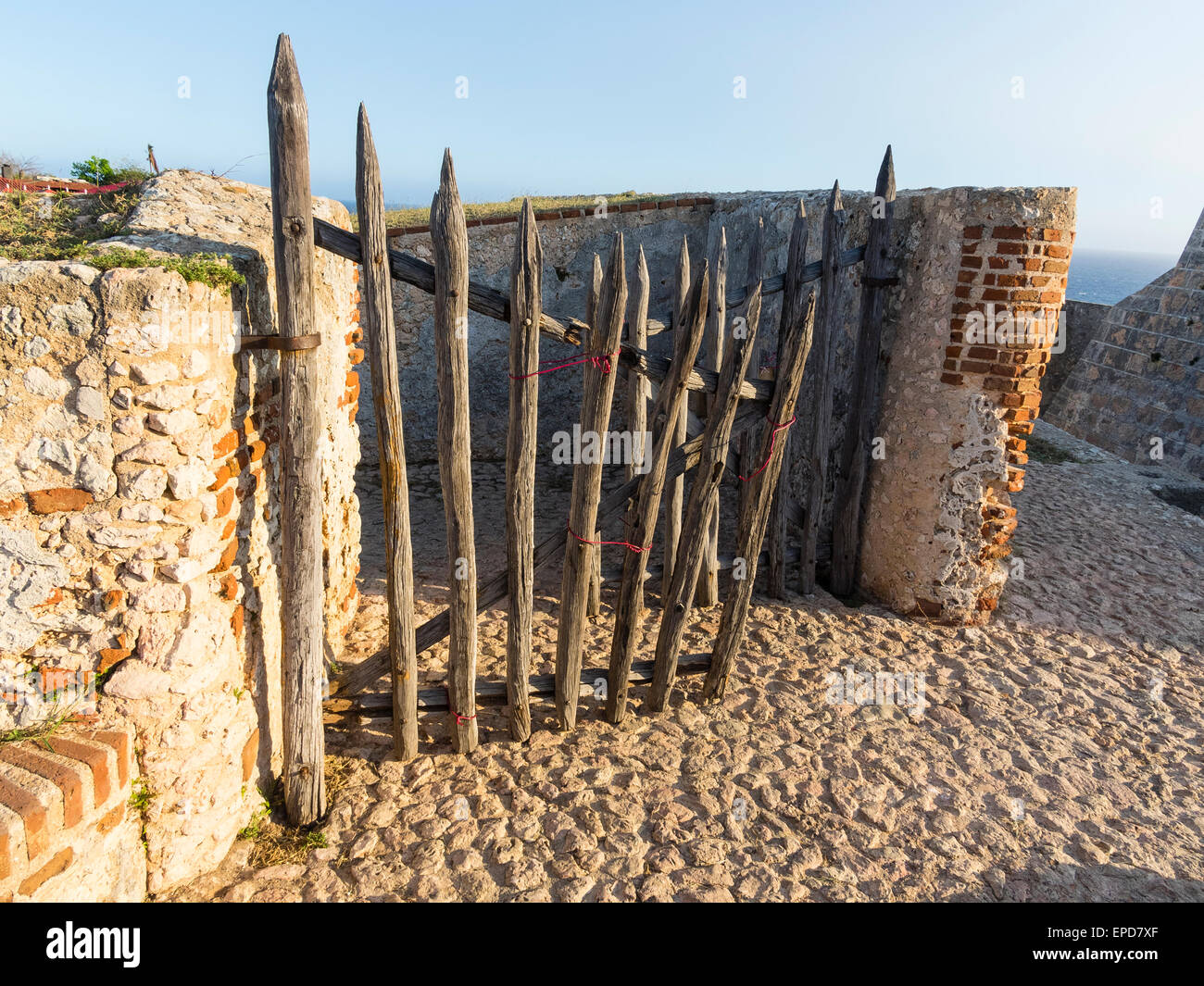 Old wooden gate made of pointed columns of wood at San Pedro de la Roca ...