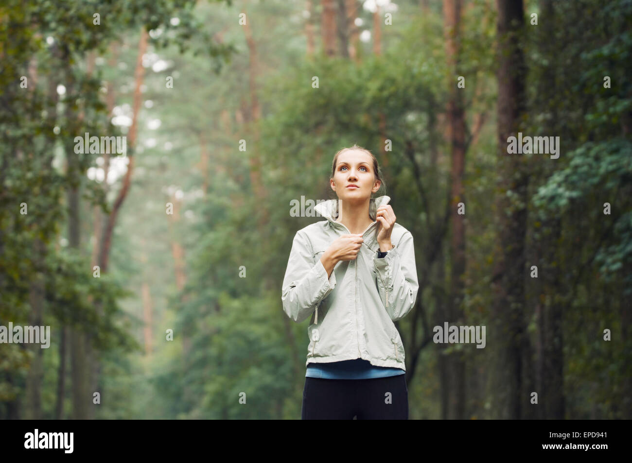 healthy lifestyle fitness sporty woman running early in the morning in forest area, fitness healthy lifestyle concept Stock Photo