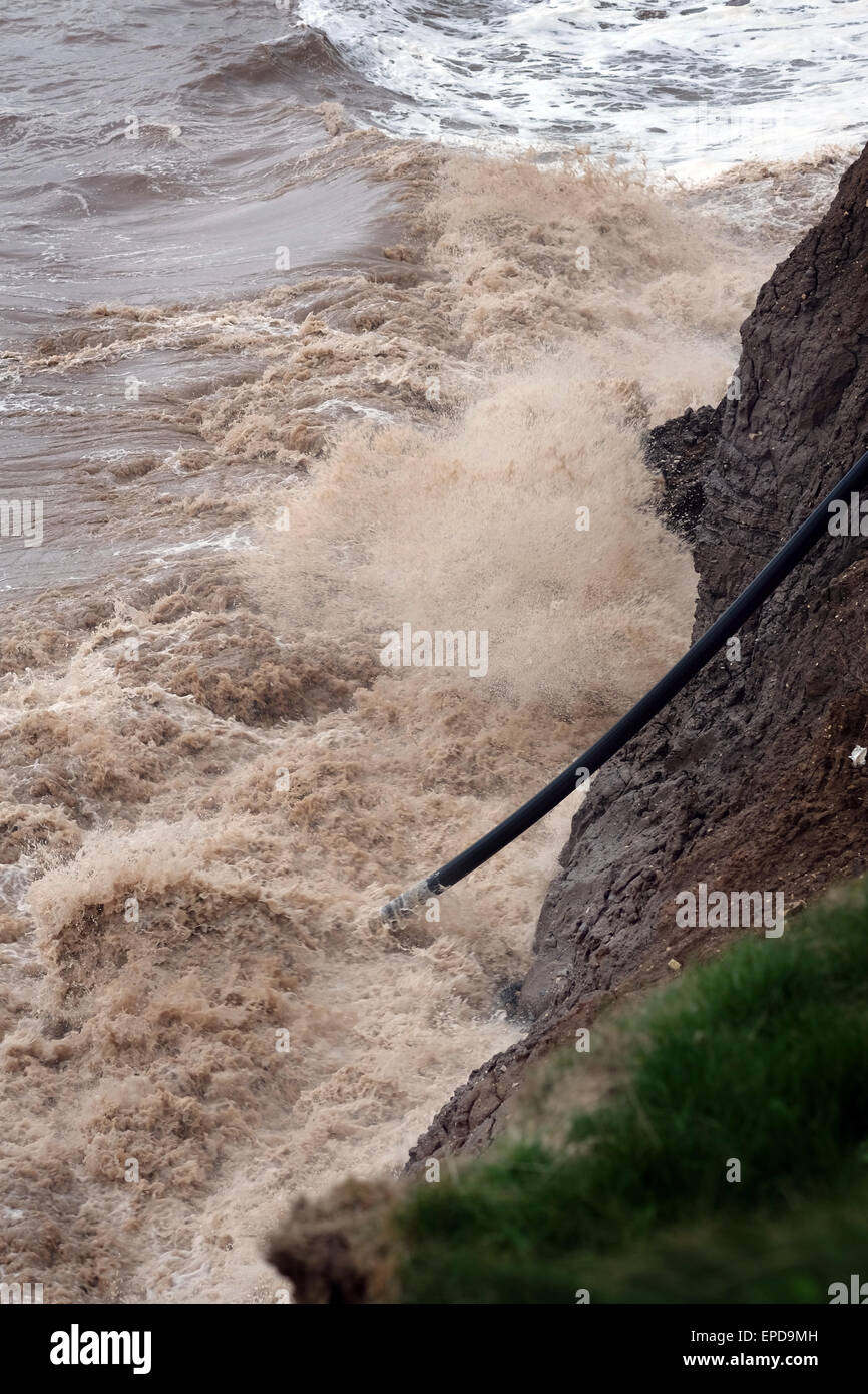 Waves eroding cliff face on east coast of Yorkshire. Stock Photo
