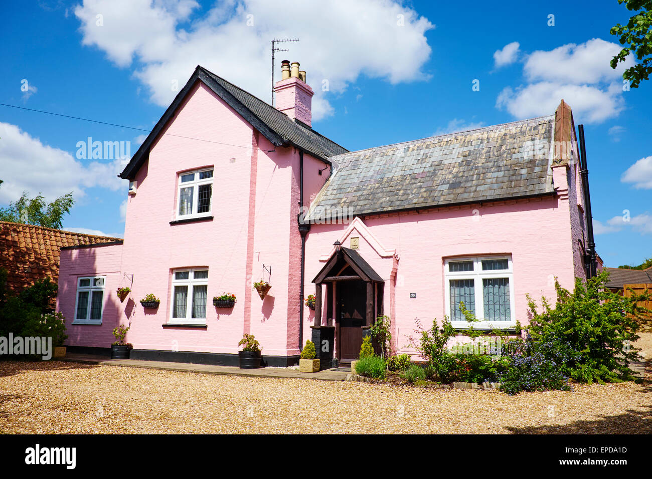 Detached House Painted Pink High Street Sandy Bedfordshire UK Stock Photo