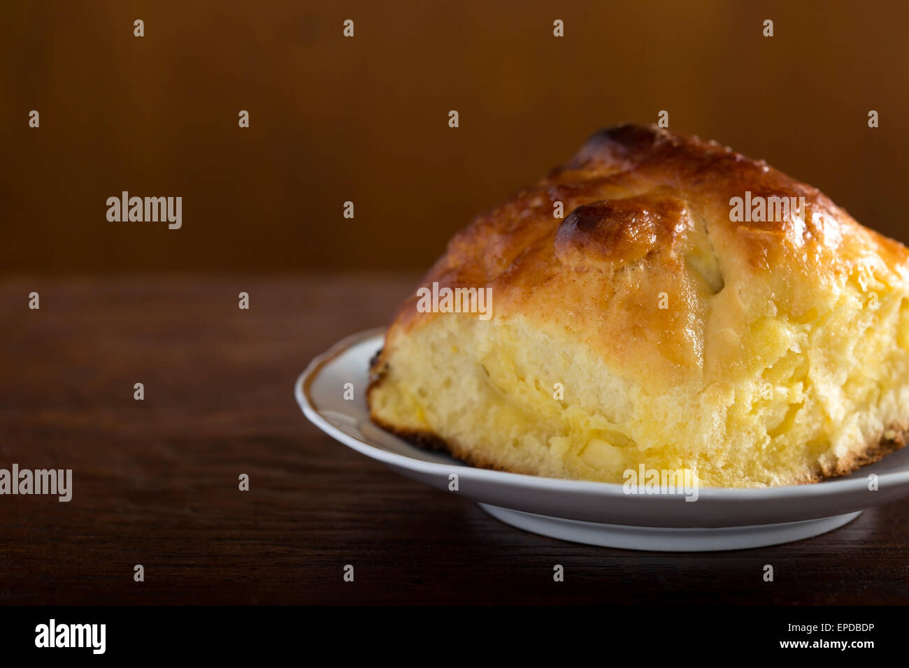 Cheese pie in plate on a wooden table Stock Photo