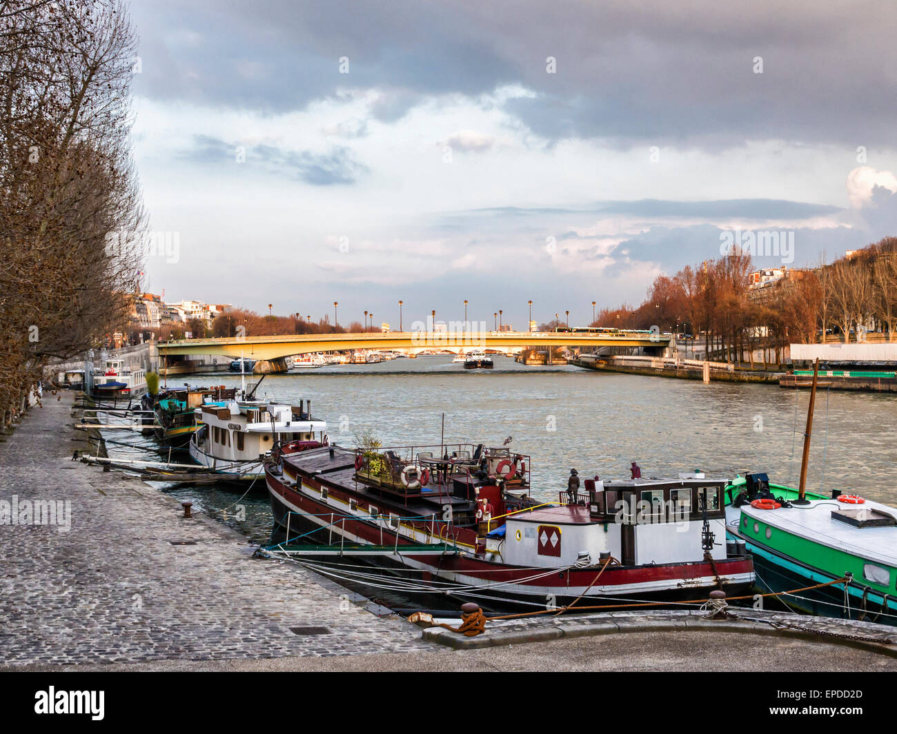 View of Pont de l'Alma bridge, houseboats and river Seine from the