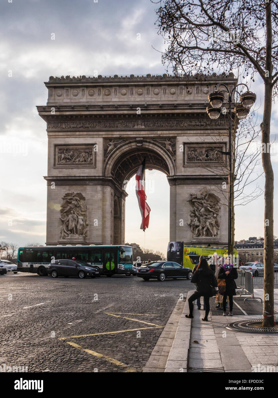 Arc de Triomphe de l'Etoile Champs Elysees in Paris. Tourists at Historic monument. Triumphal arch honours dead soldiers Stock Photo