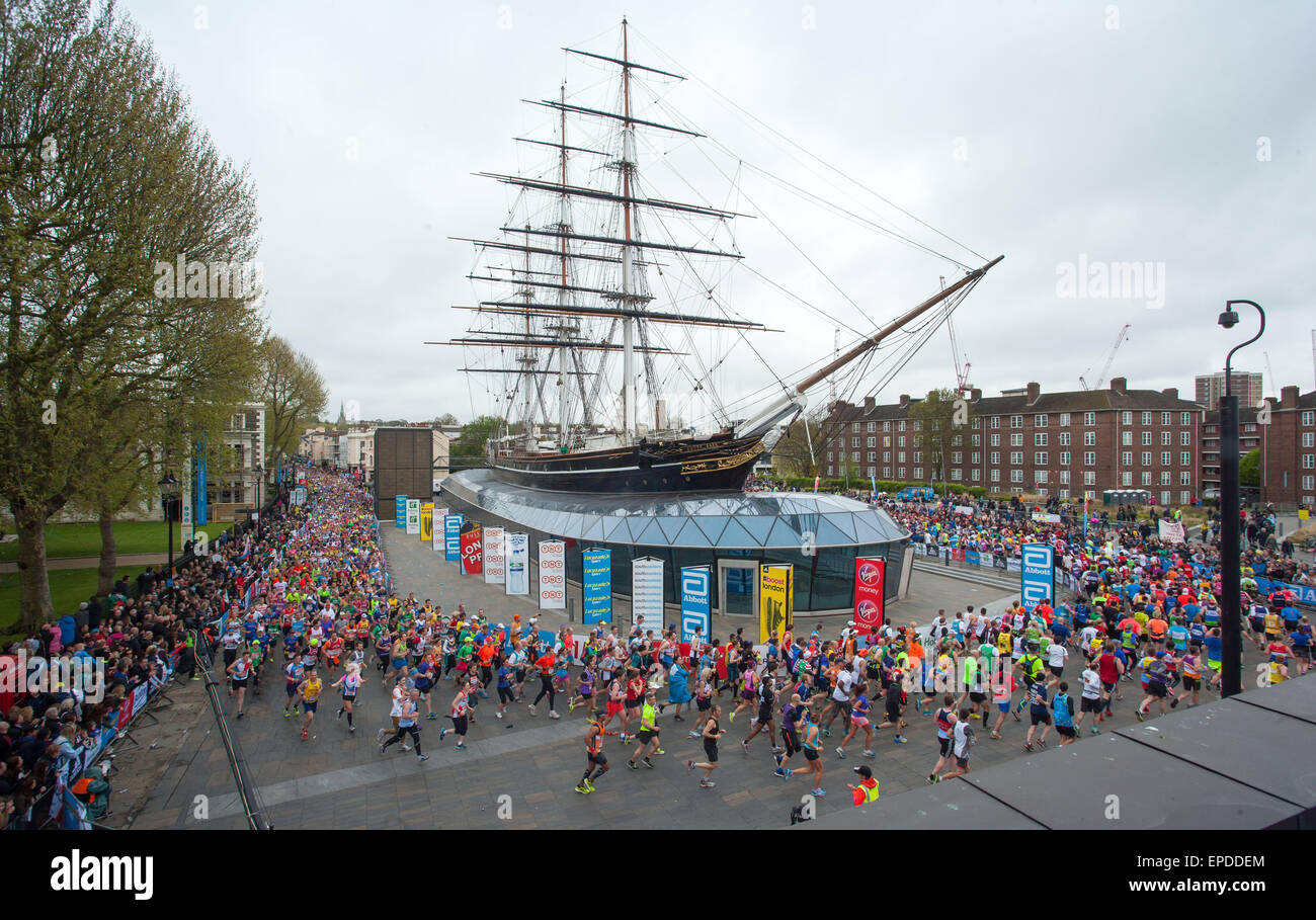 London Marathon runners pass the Cutty Sark in Greenwich, London, Britain Stock Photo