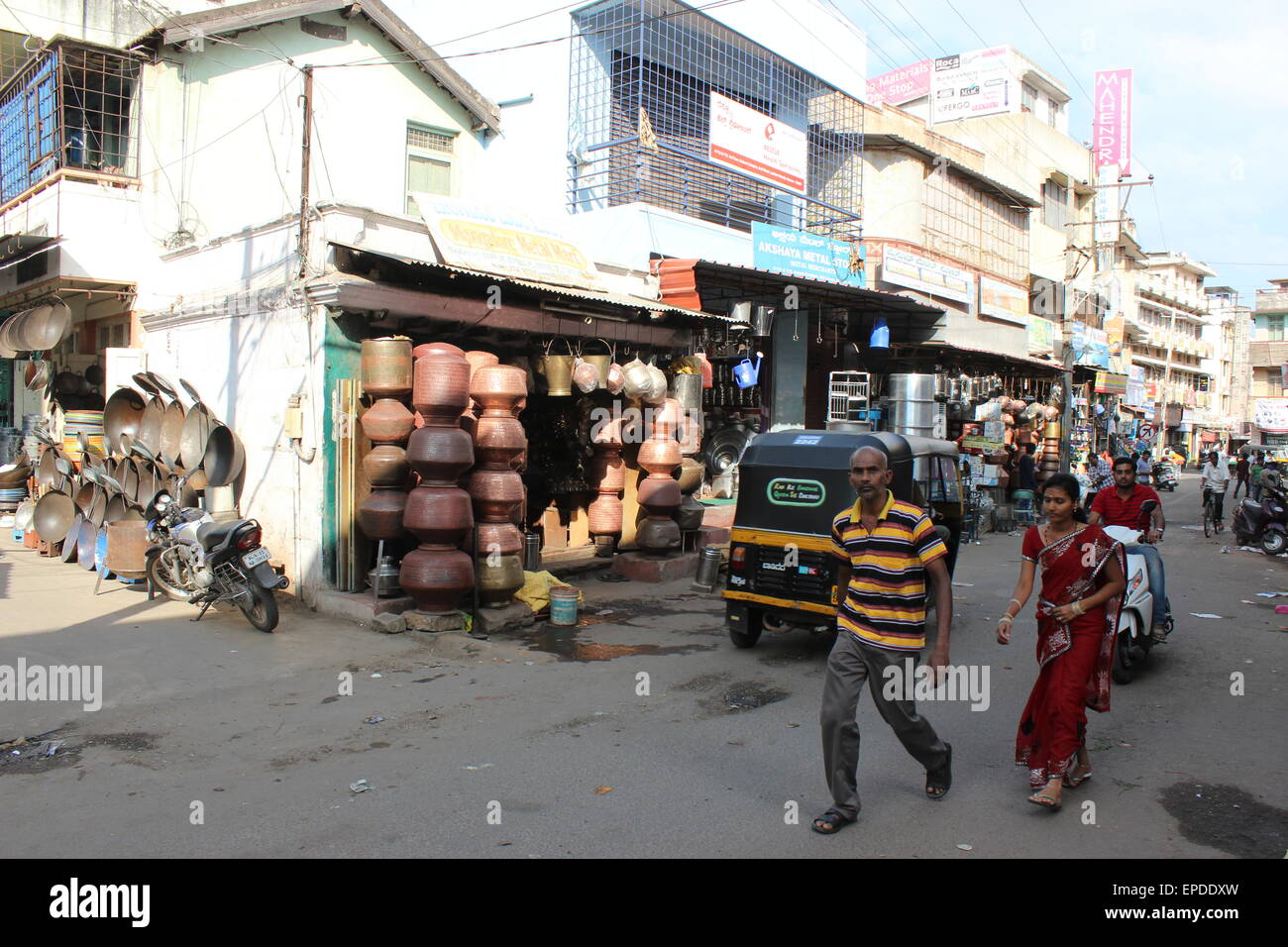 The streets and markets of central Mysore: a corner with metalware shop Stock Photo