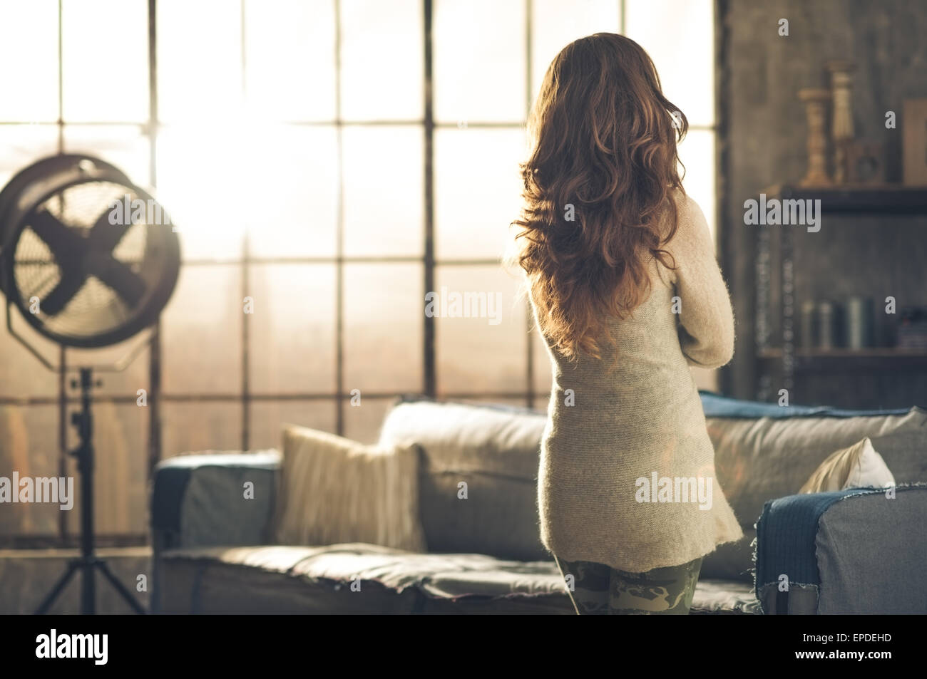 Trendy woman standing rear view hi-res stock photography and images - Alamy