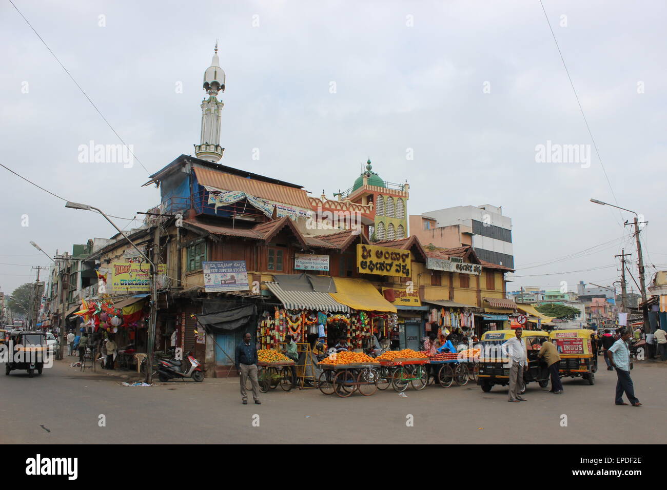 The streets and markets of central Mysore: a street corner outside Devaraja Market Stock Photo