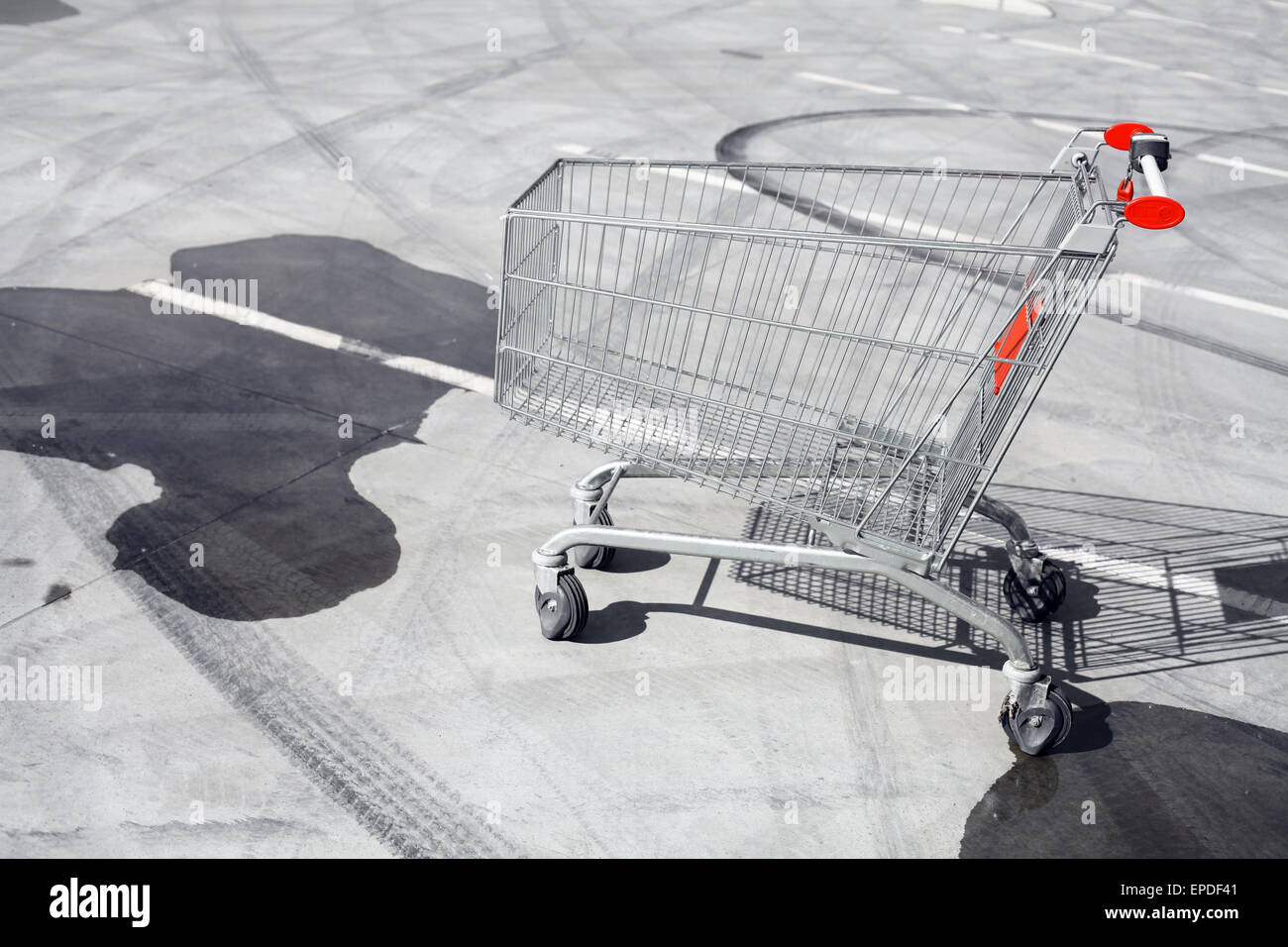 Color image of an abandoned shopping trolley in a parking lot. Stock Photo