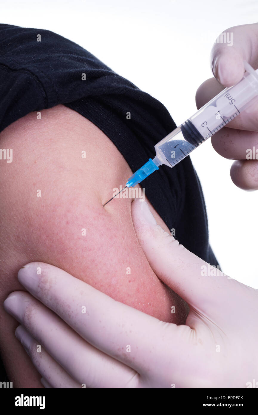 Administer Injection - Flu Shot by the Doctor Stock Photo - Alamy
