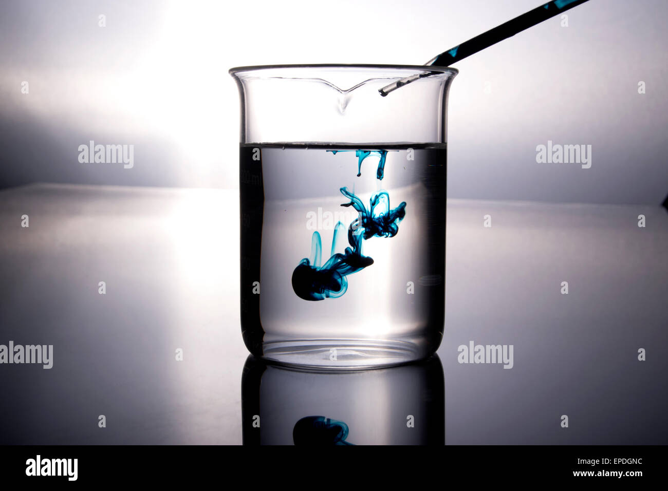 beaker with dropper and blue chemical Stock Photo Alamy