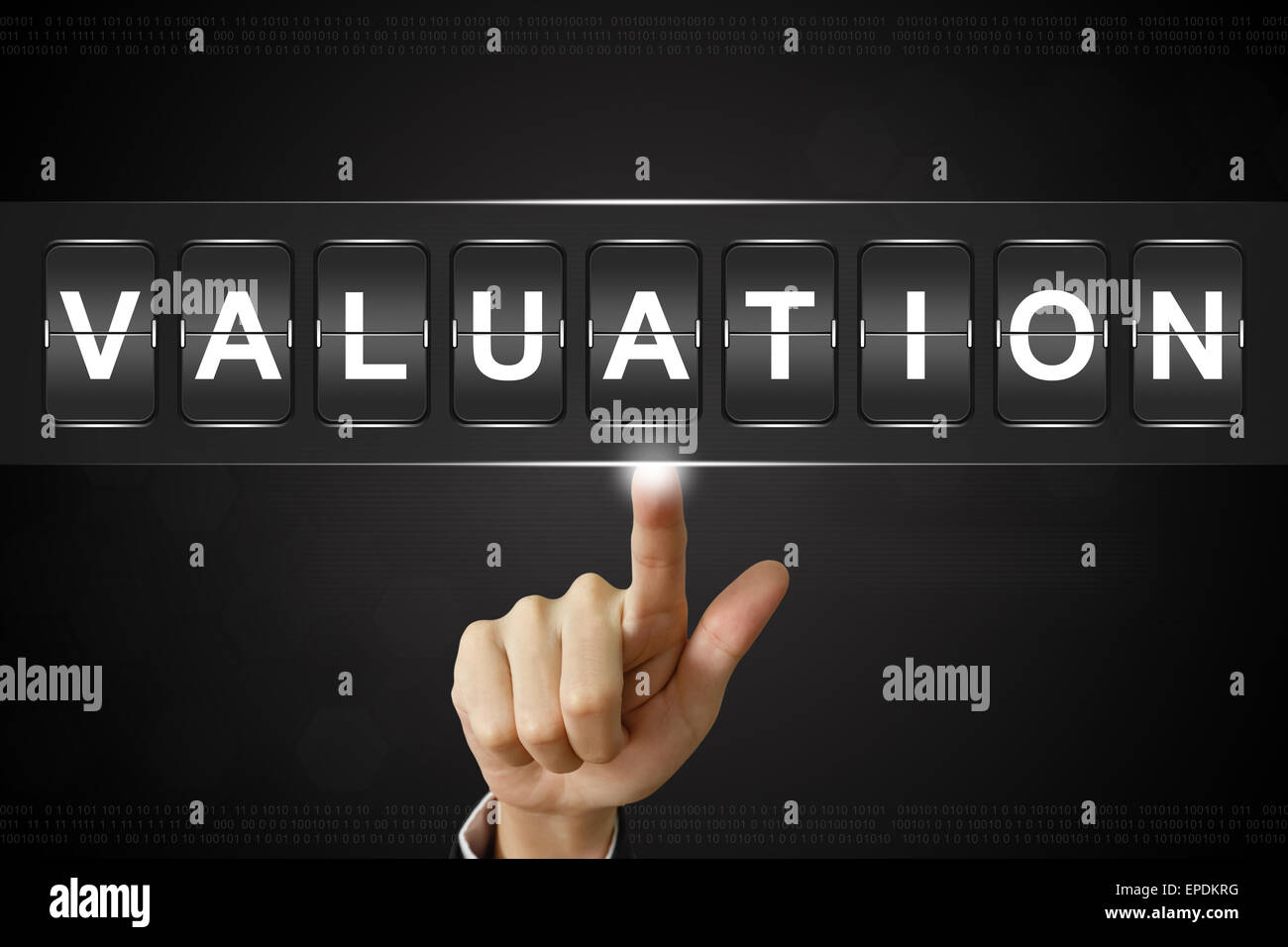 business hand pushing Valuation on Flipboard Display Stock Photo