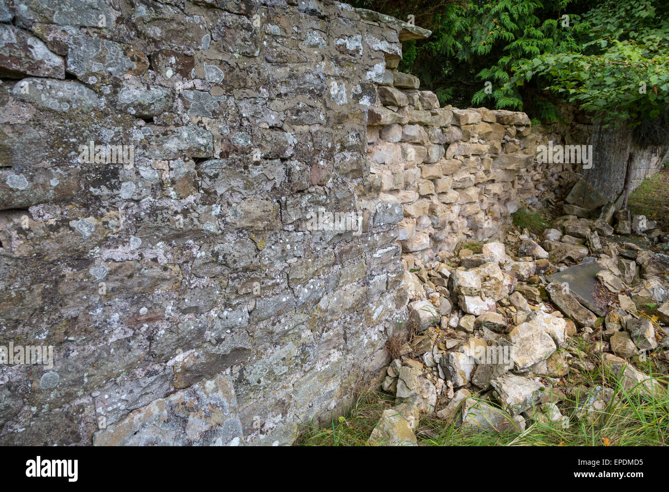 UK, England, Yorkshire.  Historic Preservation.  Collapse of a Stone Wall around a Yorkshire Country Home. Stock Photo