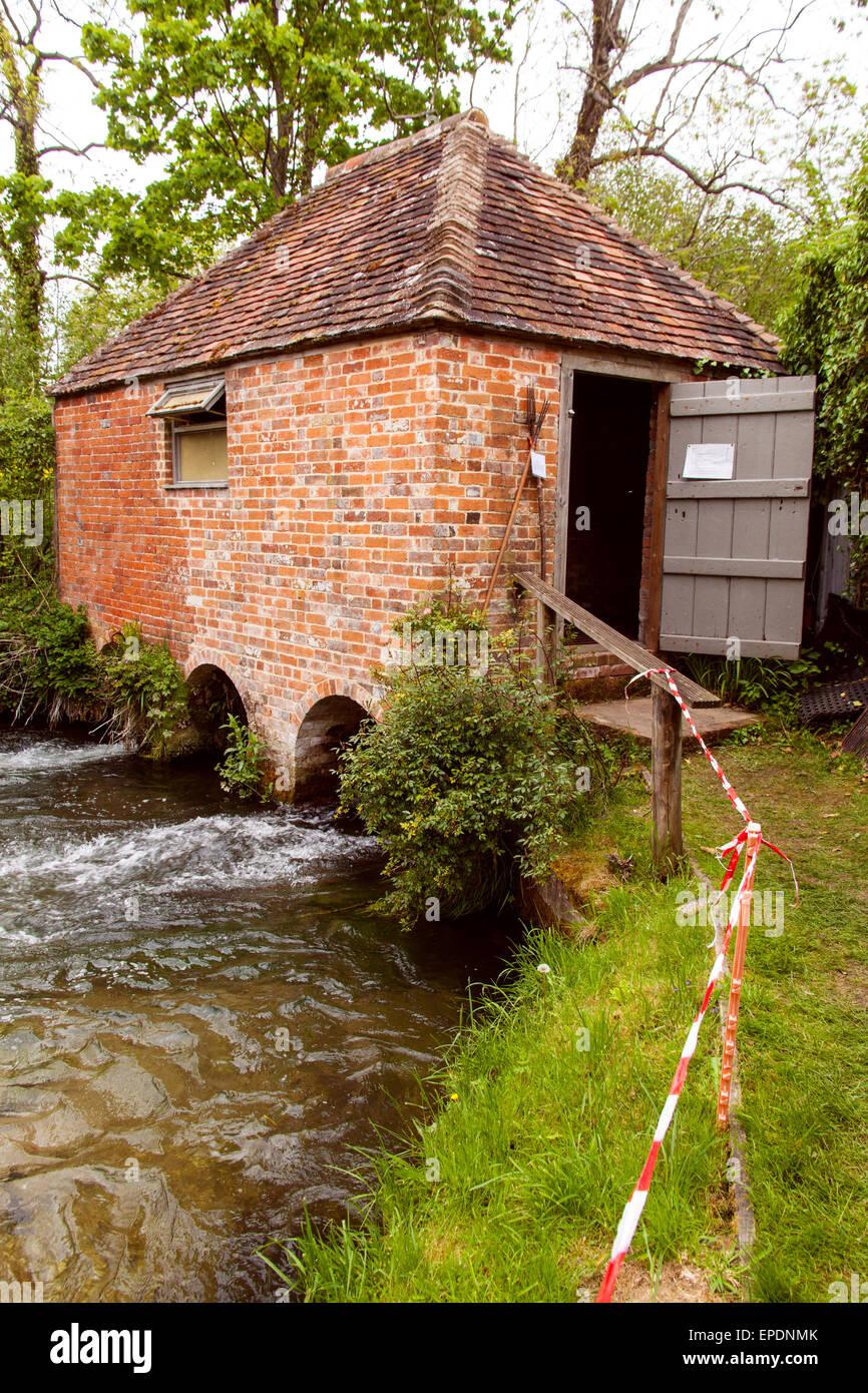 Eel House on the river Alre,  Built in the 1820s and recently restored, the eel house traps eels as the migrate to breed. Stock Photo