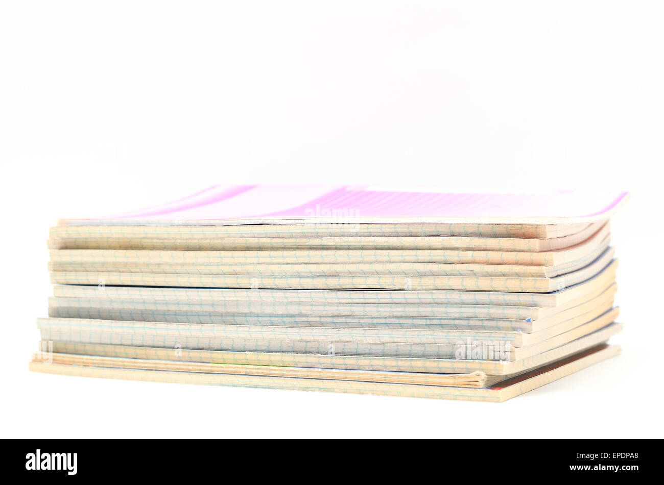 pile of exercise books on white background Stock Photo
