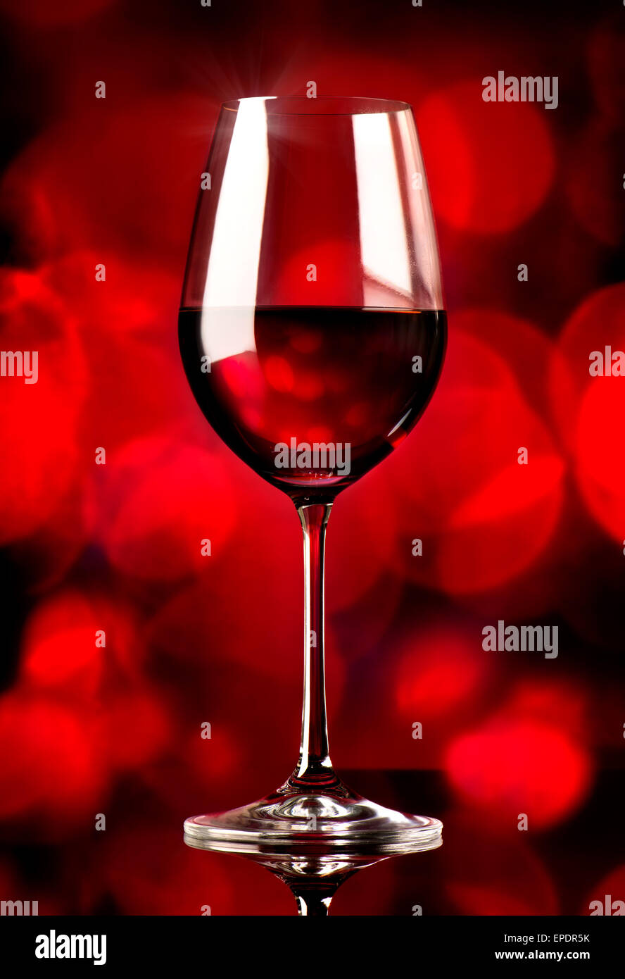 Glass of wine on a red background Stock Photo