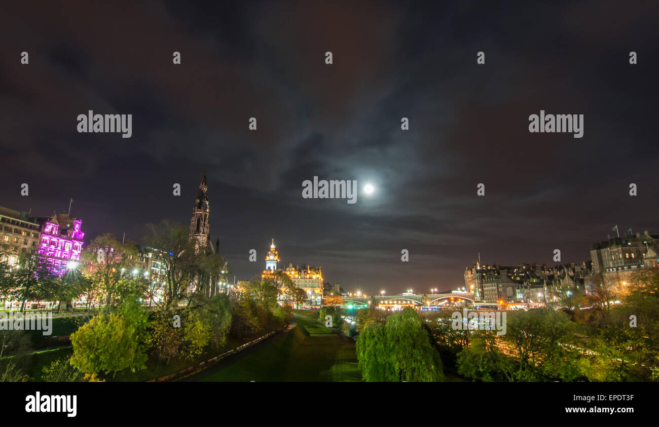 Panoramic view of the Edinburgh cityscape at night with the Scott monuments and other landmark buildings from Princes gardens Stock Photo