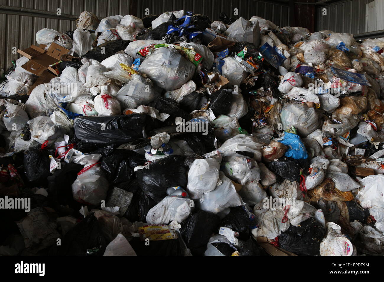 Piles of garbage disposed at a landfill in plastic bags Stock Photo Alamy