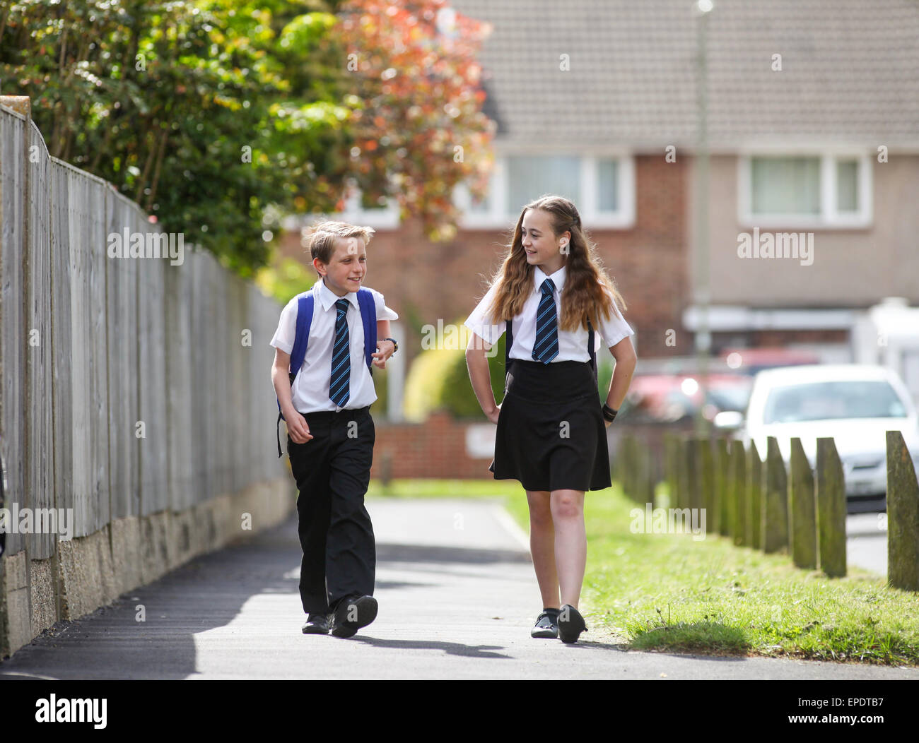 School pupils in uniform walking to school UK Stock Photo