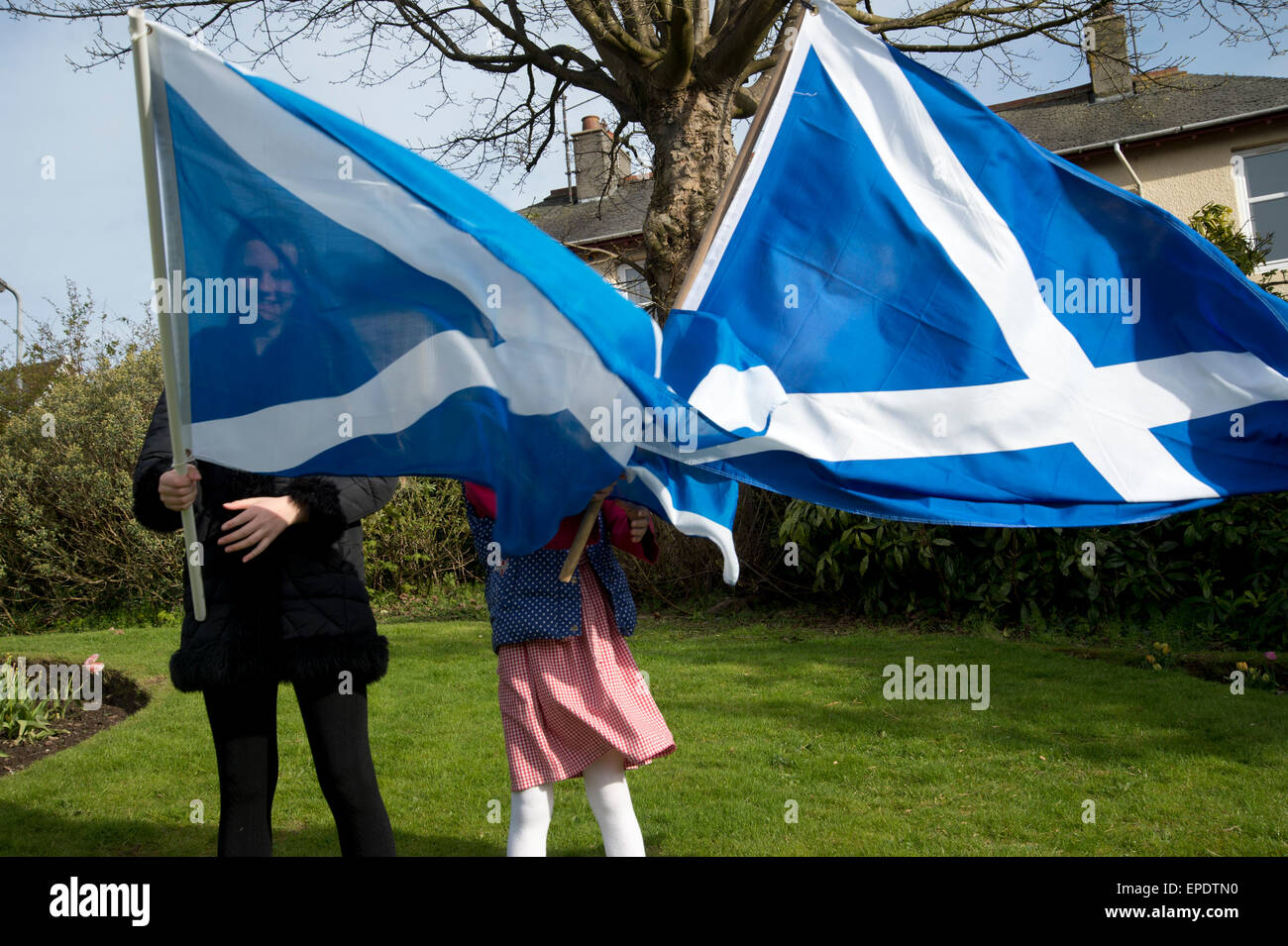 Scotland, West Kilbride. Young girls with Saltaires ( Scottish flags) about to take part in an eve of election cavalcade around Stock Photo