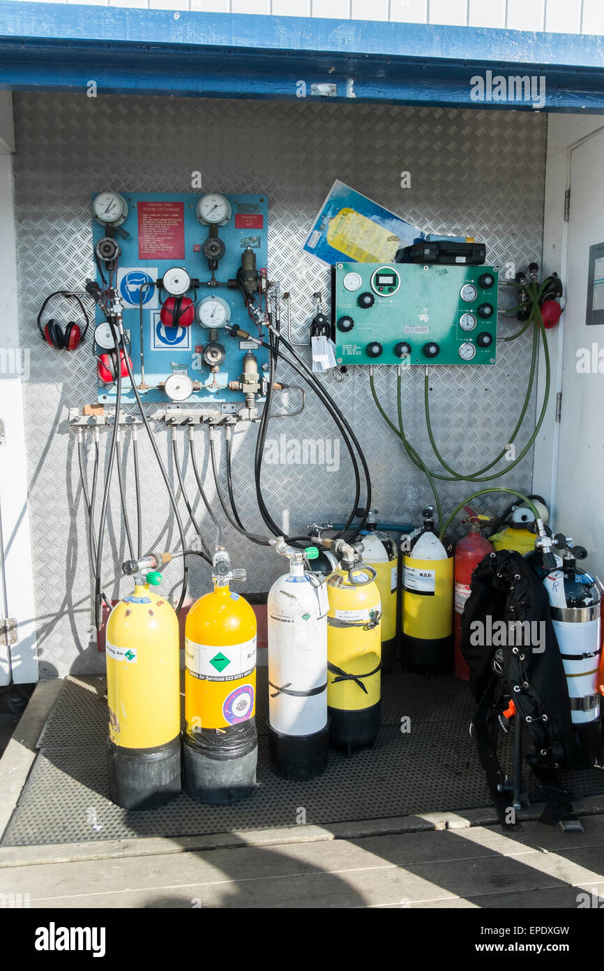 Divers air cylinders at a refilling station at Swanage Dorset UK Stock Photo
