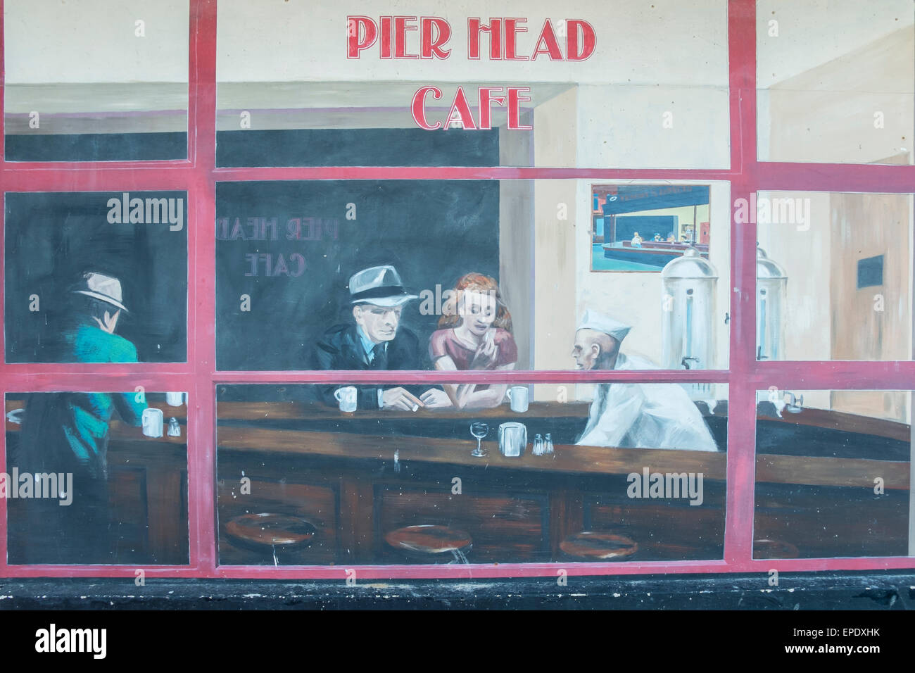 Murals painted on the side of the dilapidated Pier Head building. The seafront, Swanage. Dorset. UK Stock Photo