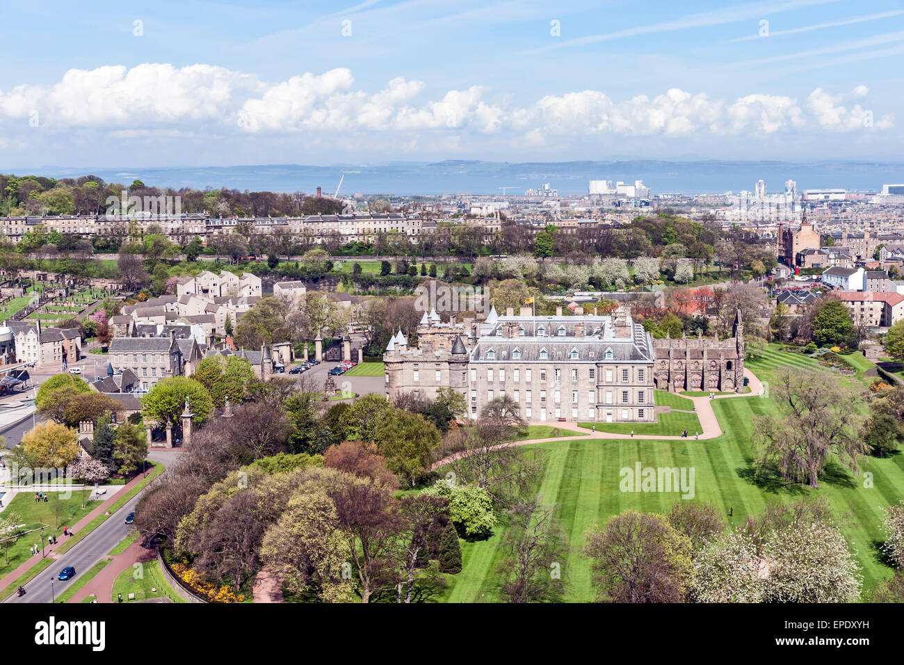 Palace of Holyroodhouse with Holyrood Abbey (r) and park in Edinburgh Scotland as seen from Salisbury Crags with view to Leith Stock Photo