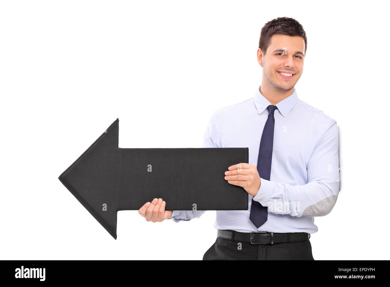 Happy young businessman holding a big black arrow pointing right and ...