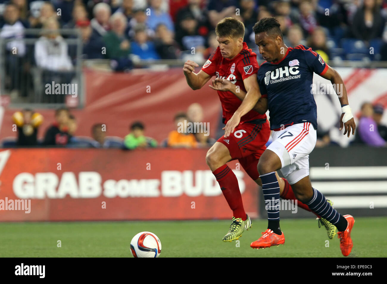 May 16, 2015; Foxborough, MA, USA; Toronto FC defender Nick Hagglund (6) and New England Revolution forward Juan Agudelo (17) battle for the ball dyring the first half of an MLS game between the New England Revolution and Toronto FC at Gillette Stadium. New England and Toronto played to a 1-1 draw. Anthony Nesmith/CSM. Stock Photo