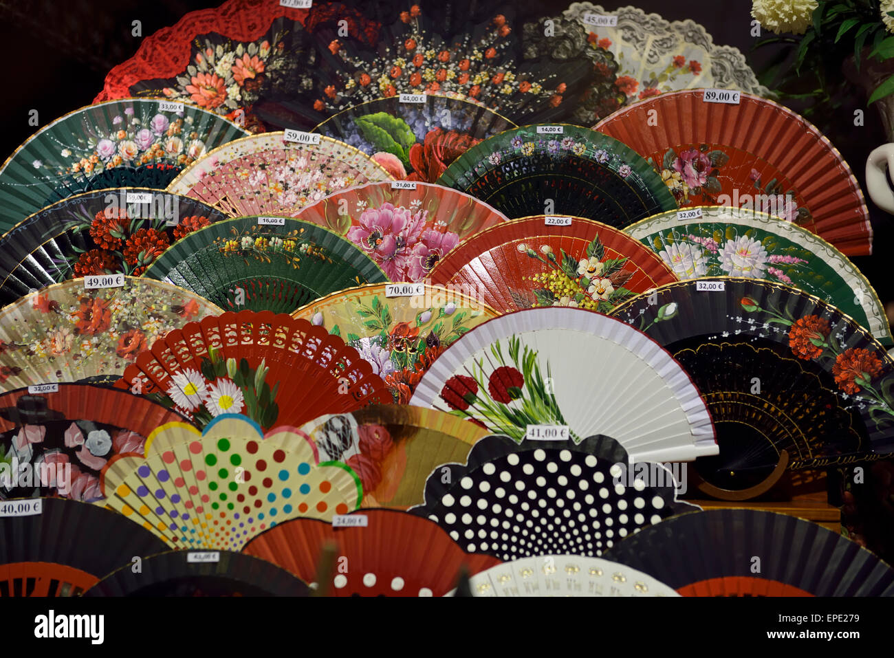 Flamenco hand fans in display window Andalusia Seville Spain Stock