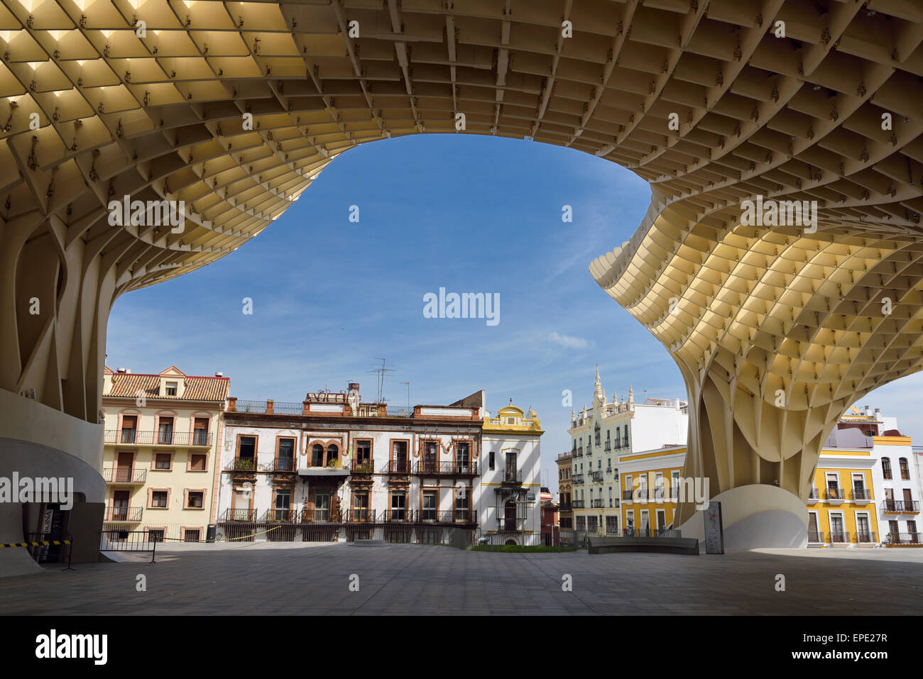Canopy of Metropol Parasol framing buildings around Plaza of the Incarnation Seville Spain Stock Photo