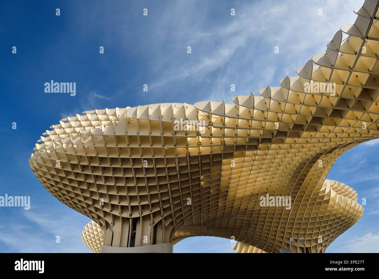 Modern abstract architecture shapes of Metropol Parasol at Plaza of the Incarnation Seville Spain against sky Stock Photo