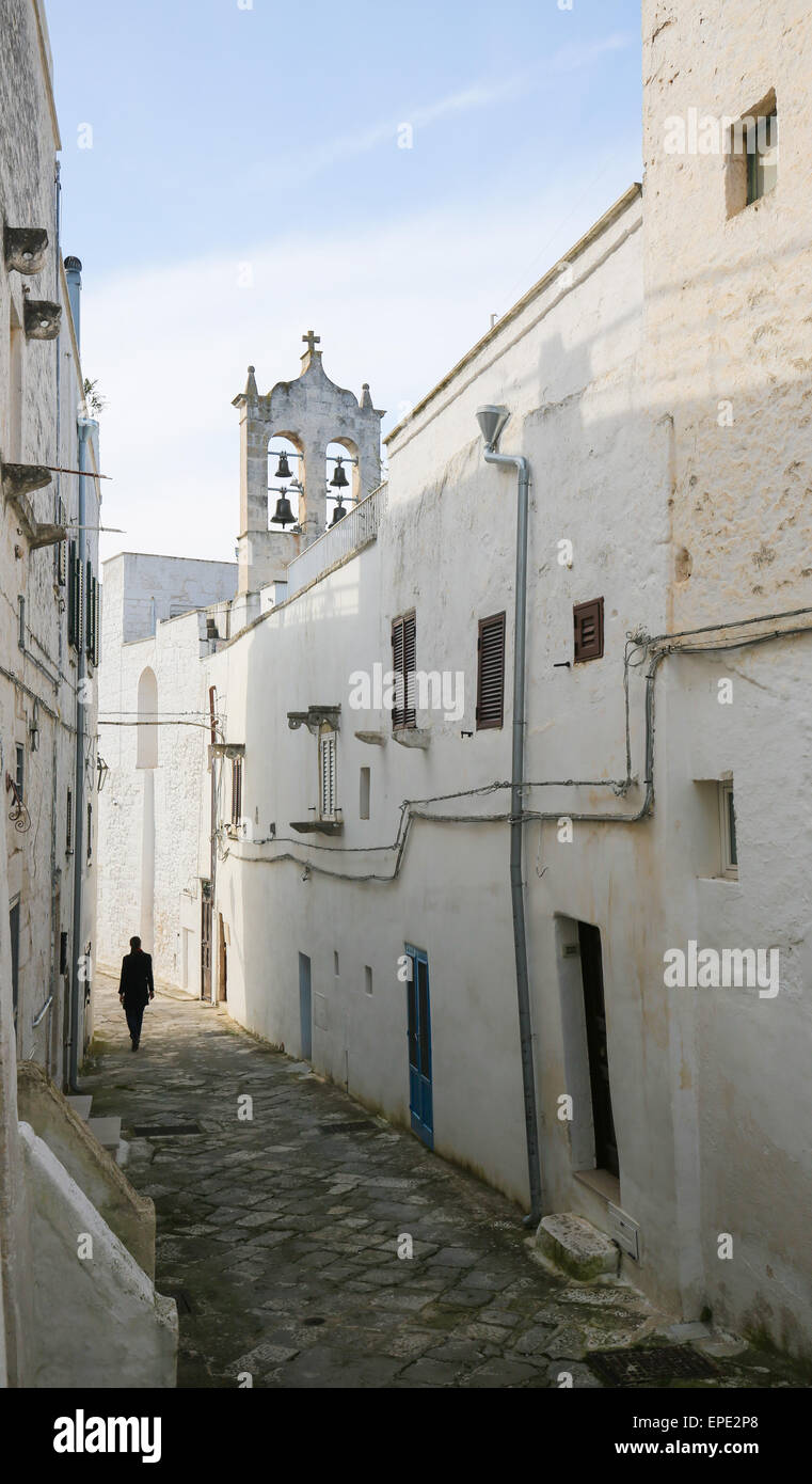Narrow alley in the center of the medieval town Ostuni in Puglia, South Italy. Stock Photo