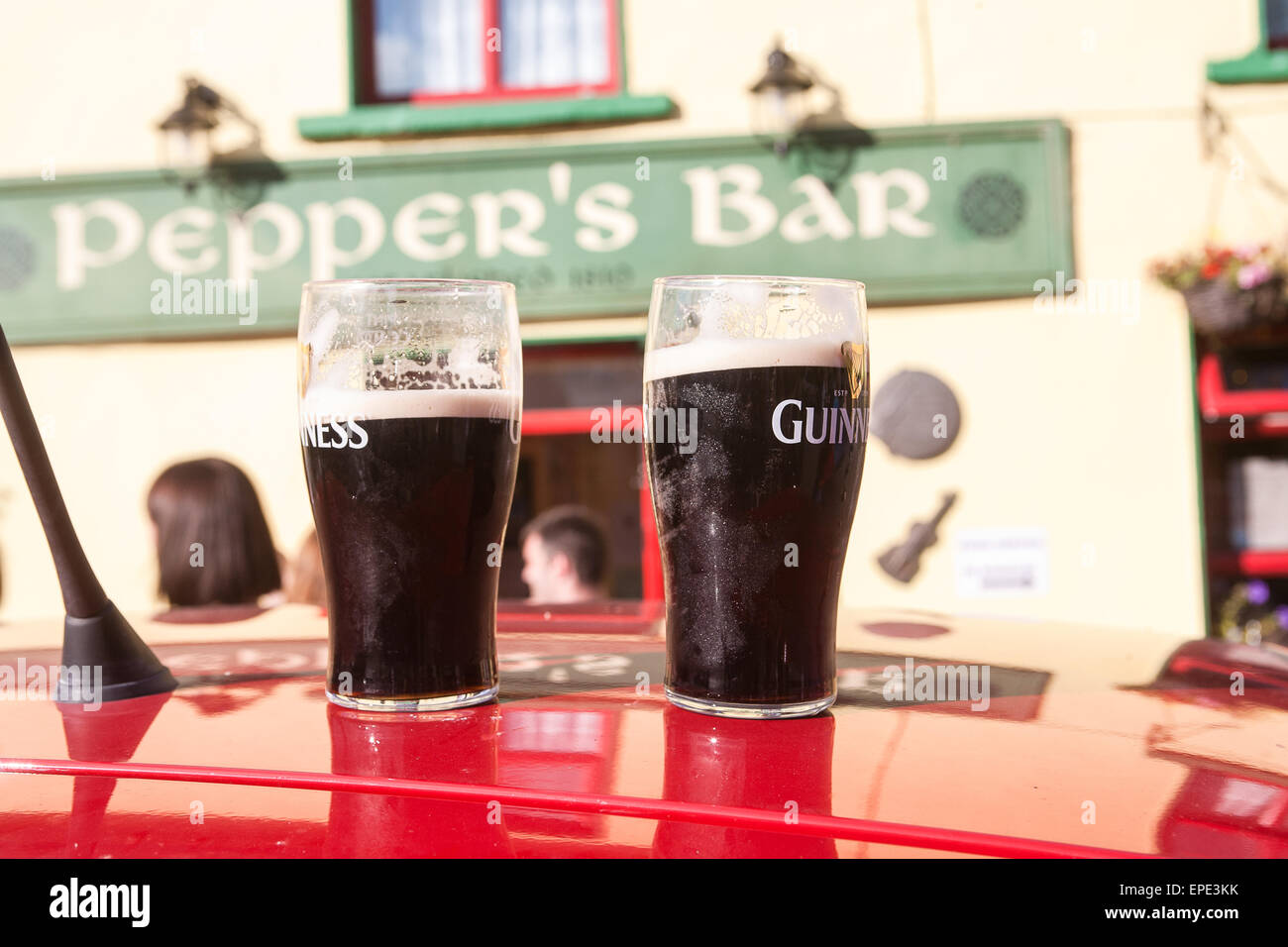 Drinking,two,pints,having,a,pint,Pint,of,Guinness,outside,Pepper's Bar