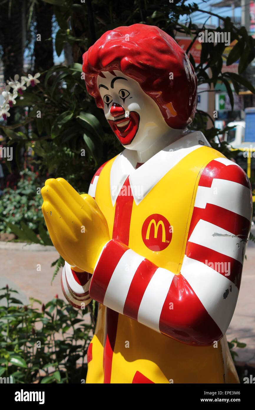 Mcdonalds mascot Ronald Macdonald in Thailand posed in traditional Thai welcome with hands mcdonald, ronald, america, wai, Stock Photo