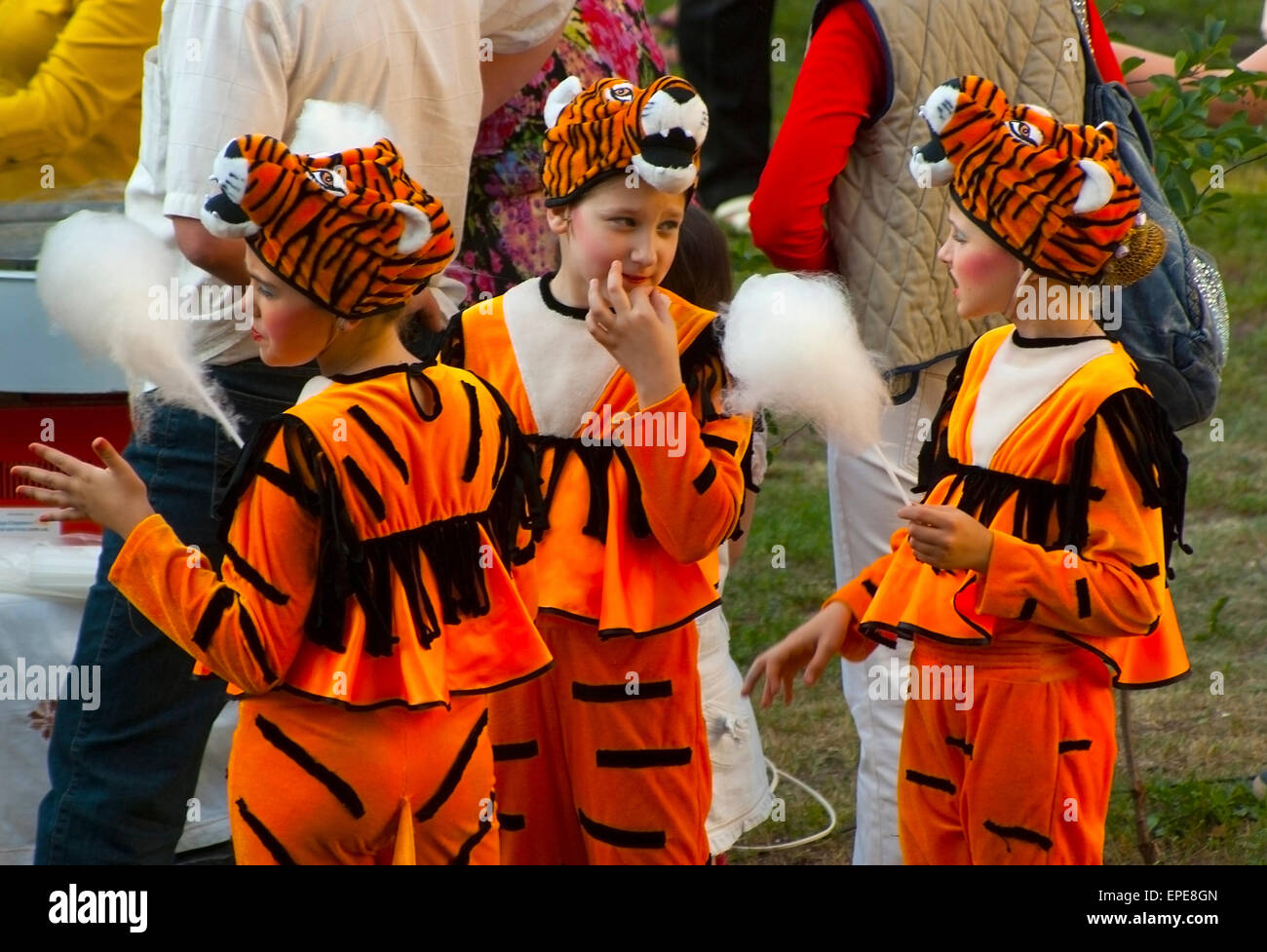 Girls in costumes tigers at the festival. Stock Photo