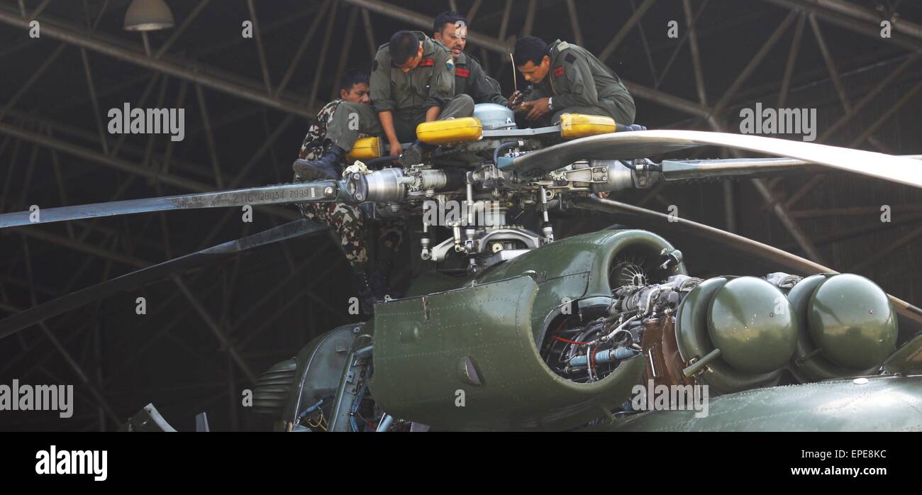 Kathmandu, Nepal. 17th May, 2015. Nepalese Army personnel make a regular maintenance for an army chopper in Kathmandu, Nepal, May 17, 2015. Three bodies had been recovered near the wreckage of a missing U.S. military chopper, an official from the Nepal government confirmed Friday. The U.S. military chopper, which was on a rescue mission in the worst quake-hit areas of Dolakha, lost contact on May 12. There were eight people on board the military chopper including two Nepalese soldiers and six U.S. marines. © Sunil Sharma/Xinhua/Alamy Live News Stock Photo