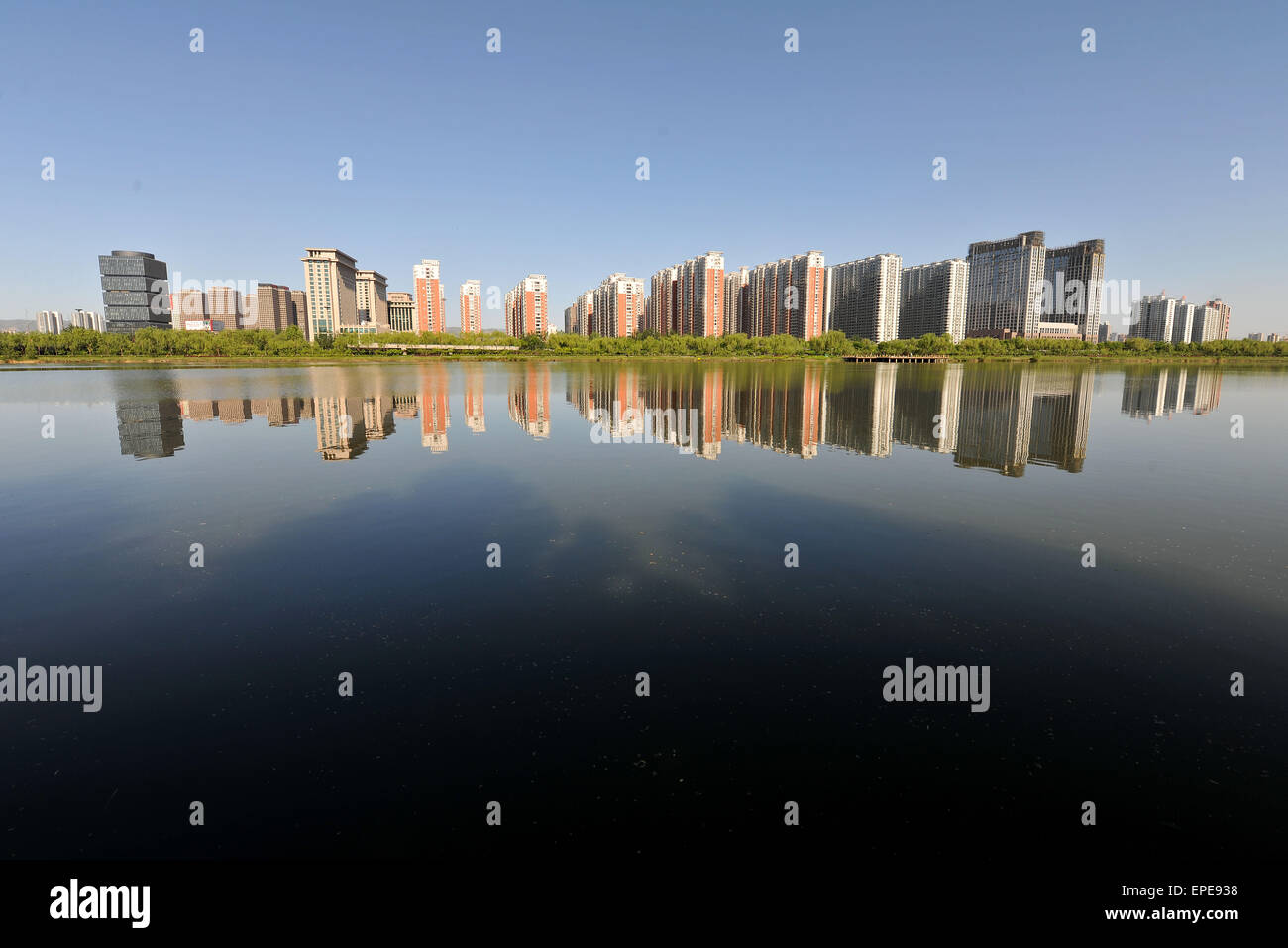 Taiyuan. 18th May, 2015. Photo taken on May 18, 2015 shows commercial residential buildings in Taiyuan, capital of north China's Shanxi Province. China's real estate market remained anemic with new home prices in April registering month-on-month declines in 48 of the 70 surveyed cities. © Zhan Yan/Xinhua/Alamy Live News Stock Photo