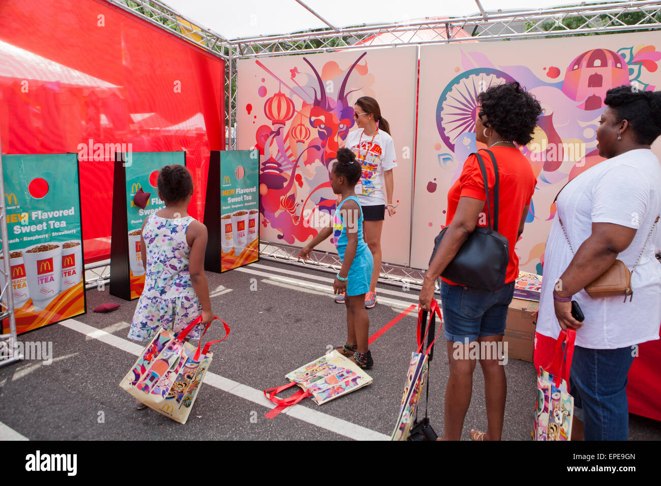 People at a McDonalds promotional booth at an outdoor festival - USA Stock Photo