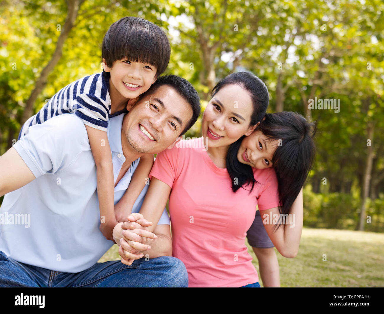 happy asian family outdoors Stock Photo