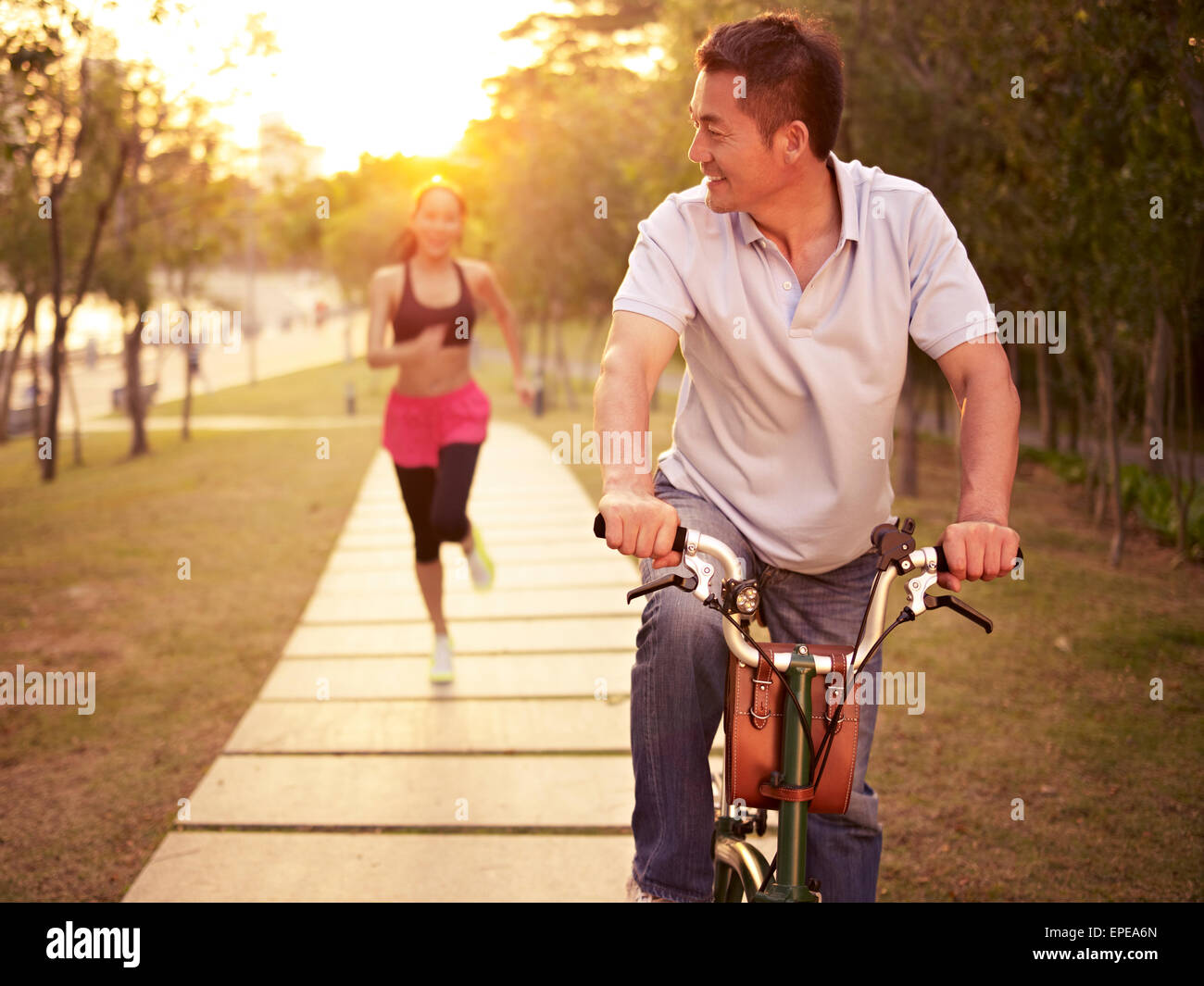 asian couple exercising in park Stock Photo - Alamy