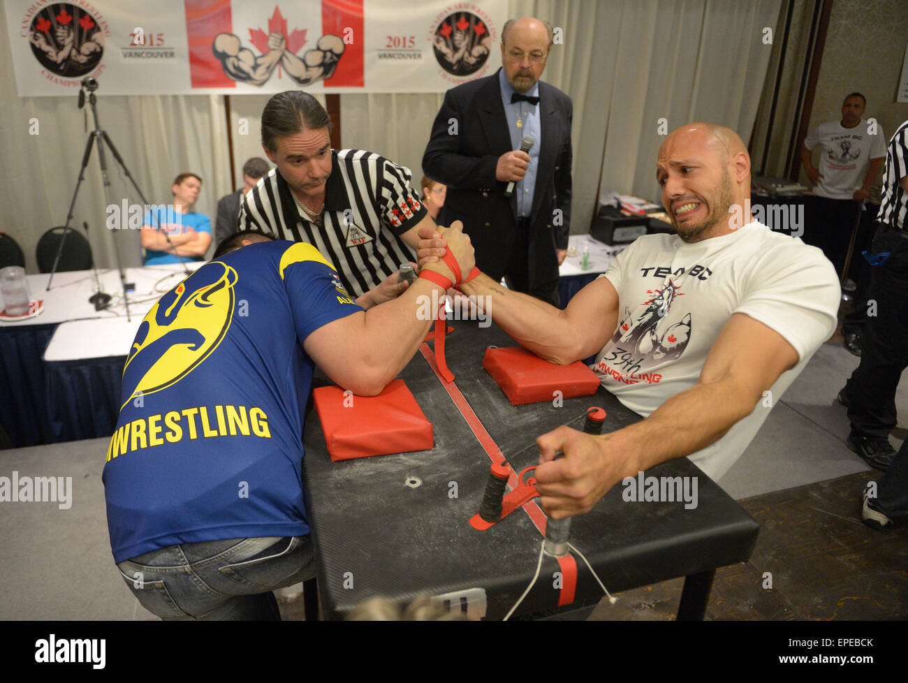 Vancouver, Canada. 17th May, 2015. Arm wrestlers compete during the 2015 Canadian Arm Wrestling Championships in Vancouver, Canada, May 17, 2015. Best Canadian arm wrestlers gathered here to battle for the trophy and champion title. Winners will represent Canada at the 2015 World Armwrestling Championships in September in Kuala Lumpur, Malaysia. © Sergei Bachlakov/Xinhua/Alamy Live News Stock Photo