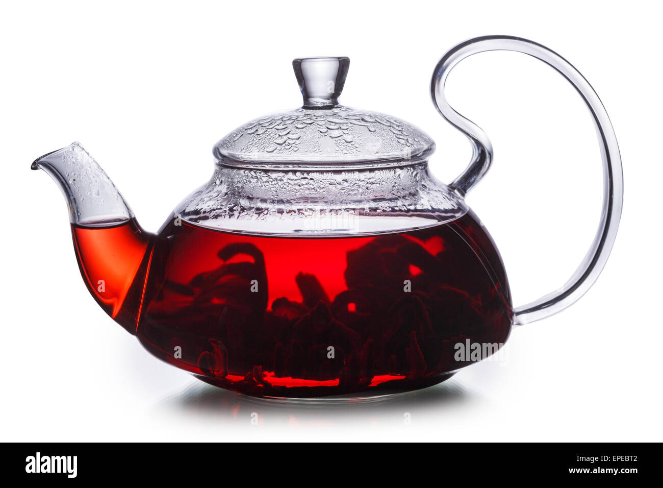 Hibiscus tea in transparent teapot. Worldwide popular healthy tea known as rosella, karkade or red sorrel. Stock Photo