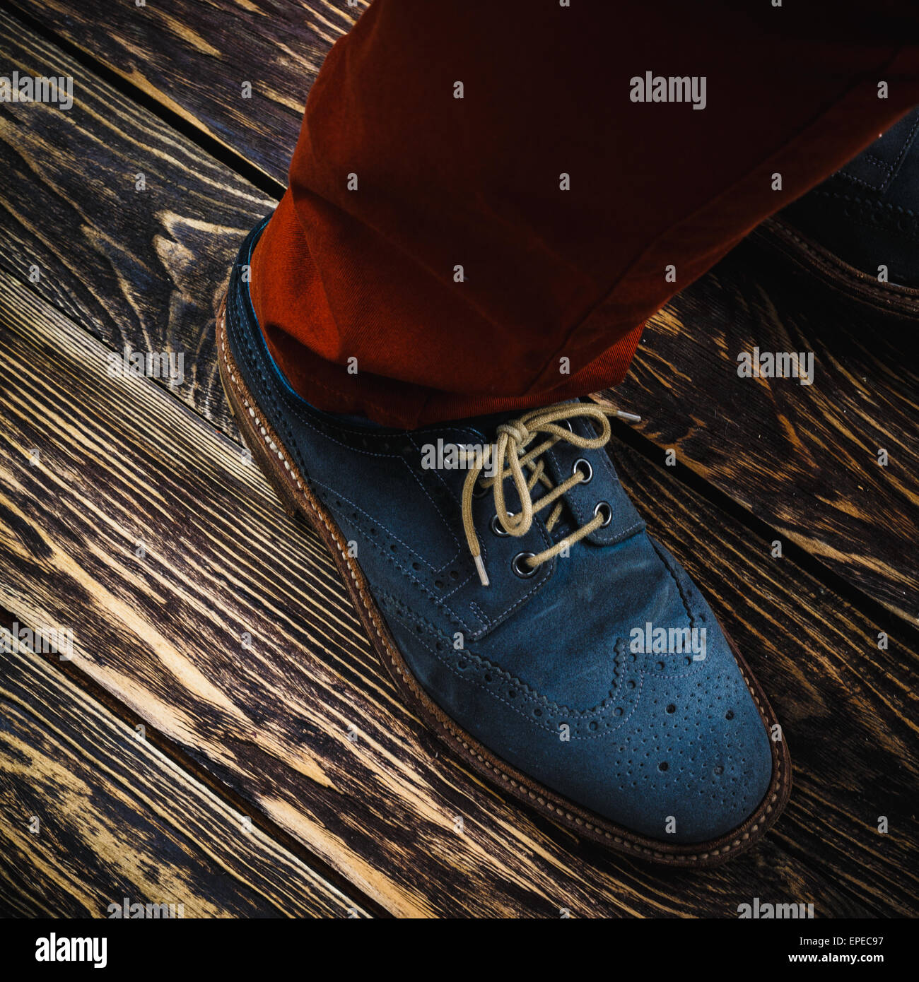 Close up of men's brogues (also known as derbies,gibsons or wingtips) made from blue oiled suede. Stock Photo