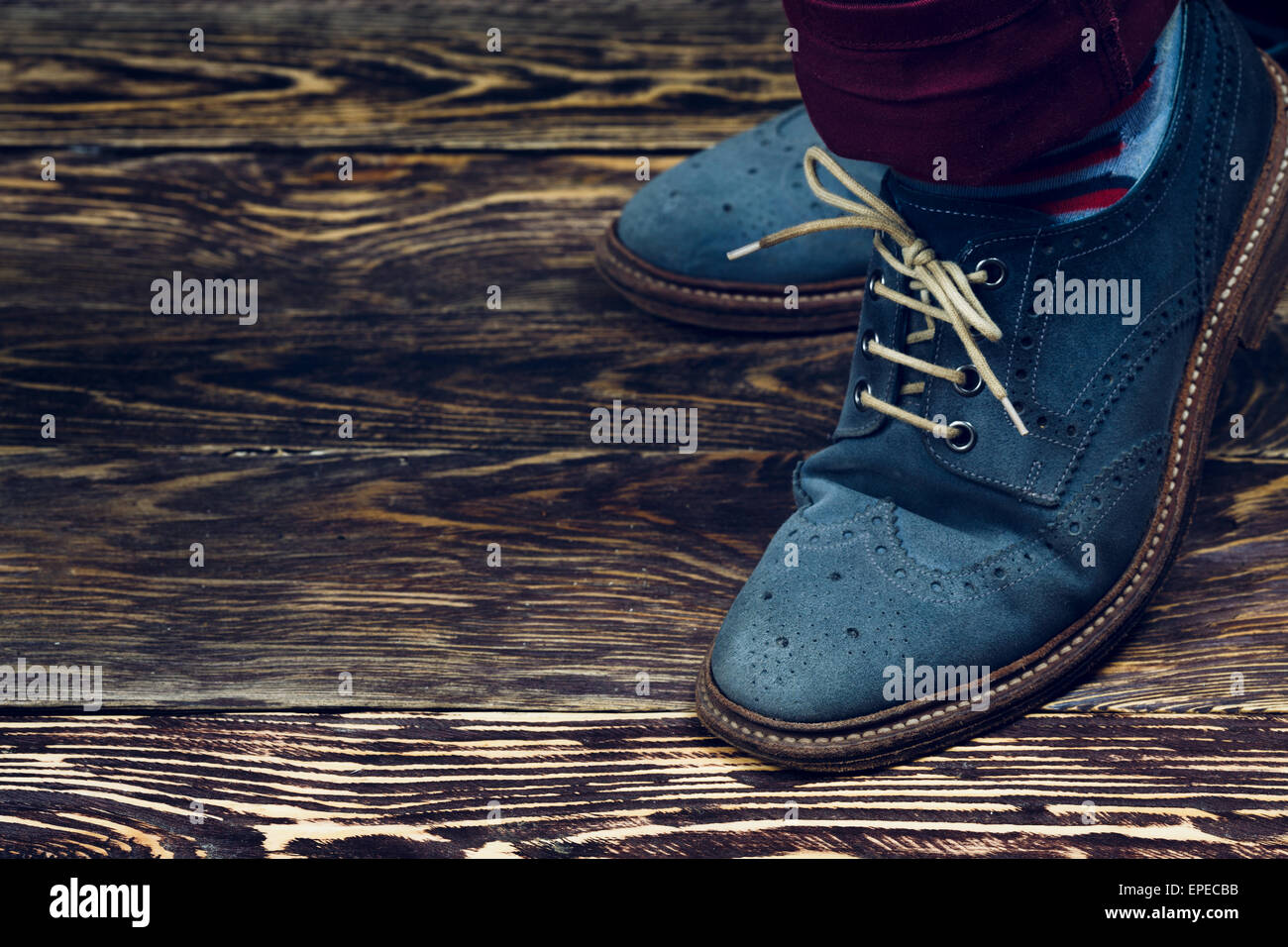 Close up of men's brogues (also known as derbies,gibsons or wingtips) made from blue oiled suede. Vintage styled Stock Photo