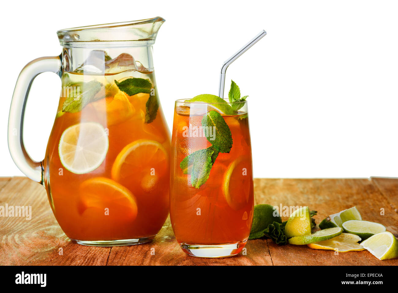 Iced tea in the pitcher and the glass. Jug of cold iced drink with